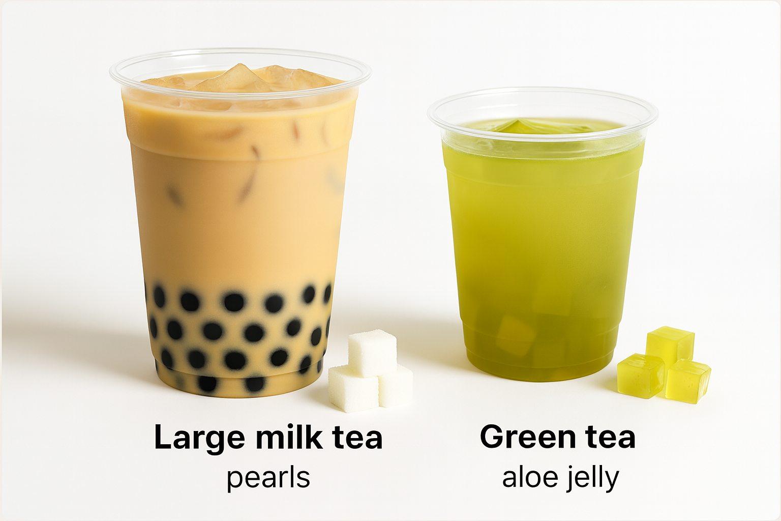 Large iced milk tea with boba pearls next to iced green tea with aloe jelly cubes on a white background, showing different bubble tea toppings.