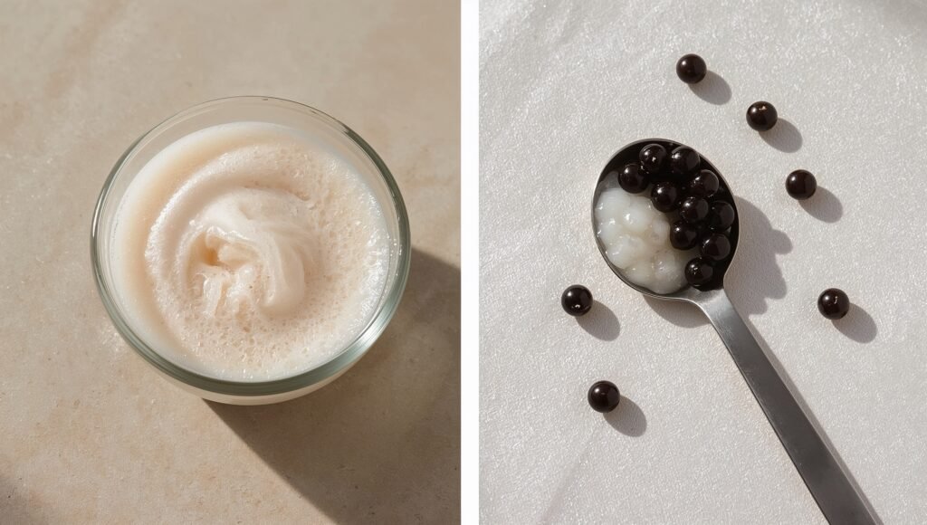 Small glass bowl of smooth light milk cap foam on a neutral surface.