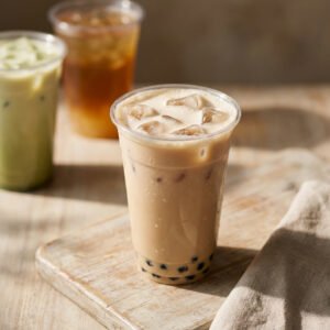 Milk tea in front with lighter bubble tea options behind for a best bubble tea chains for calories post